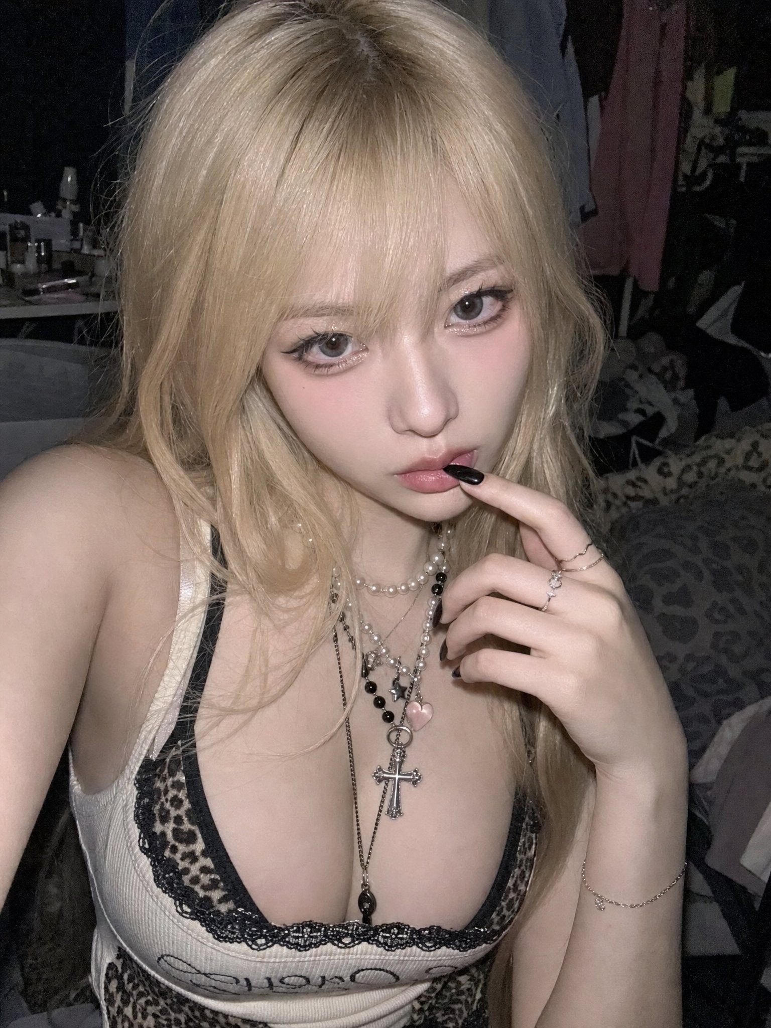 Dim bedroom blonde phone selfie