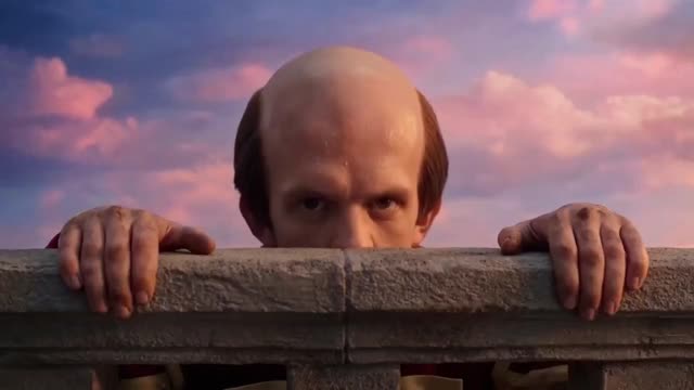 Bald Man Peeks Over Wall