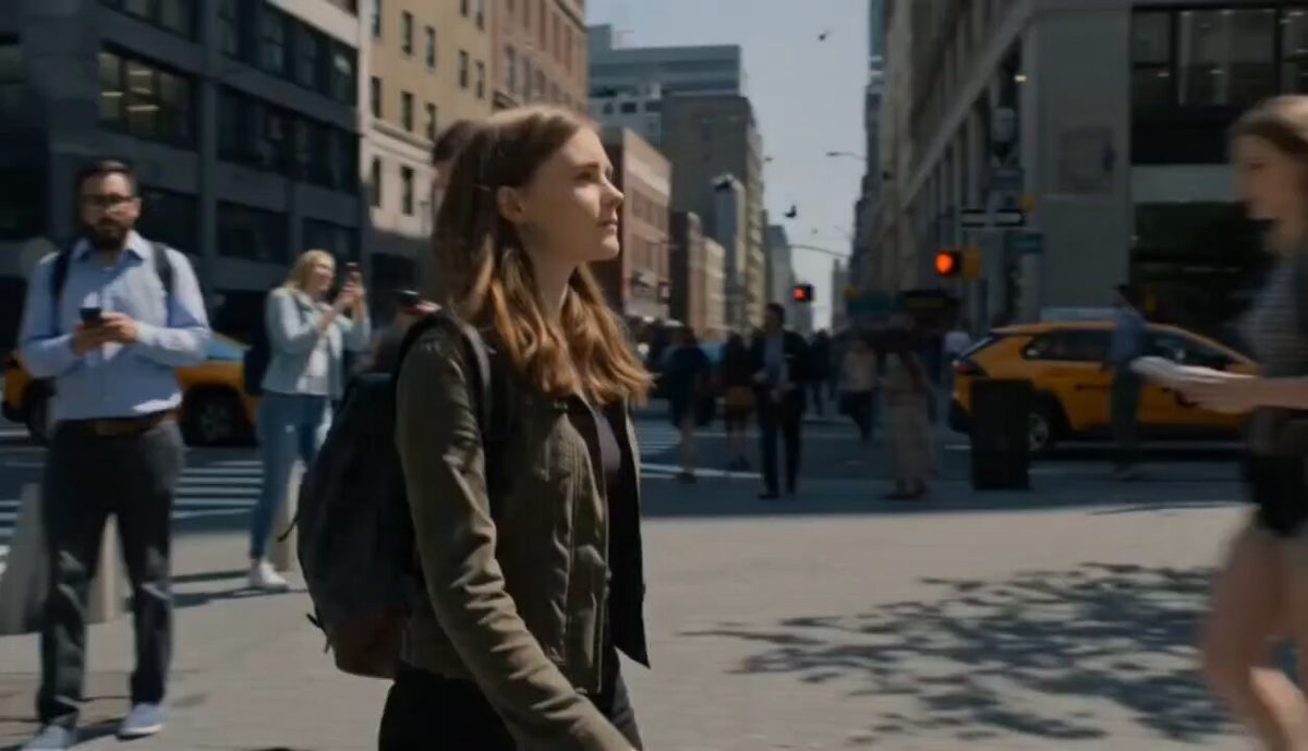 Girl walking through city freezing time