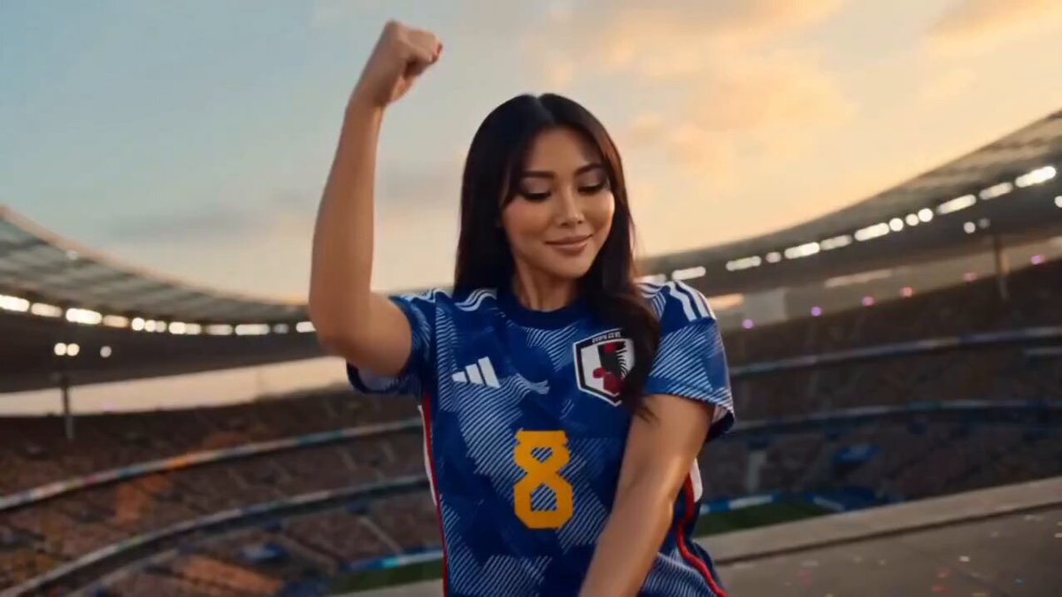 Female football fans dancing in a stadium