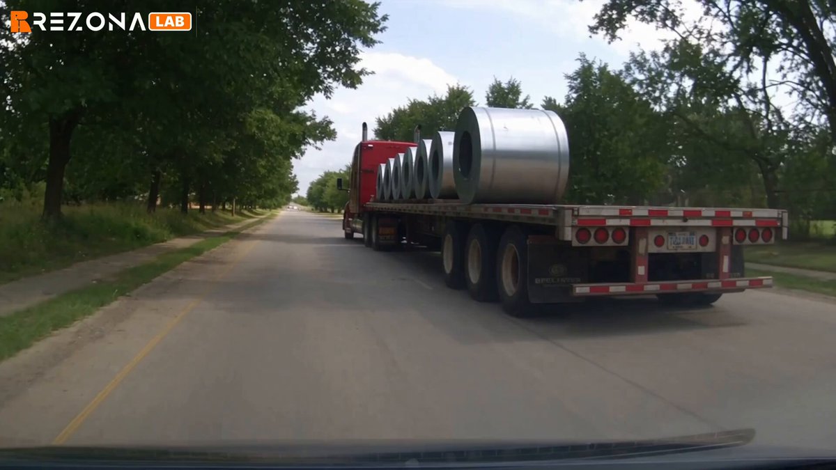 Elderly woman dashcam footage behind a truck