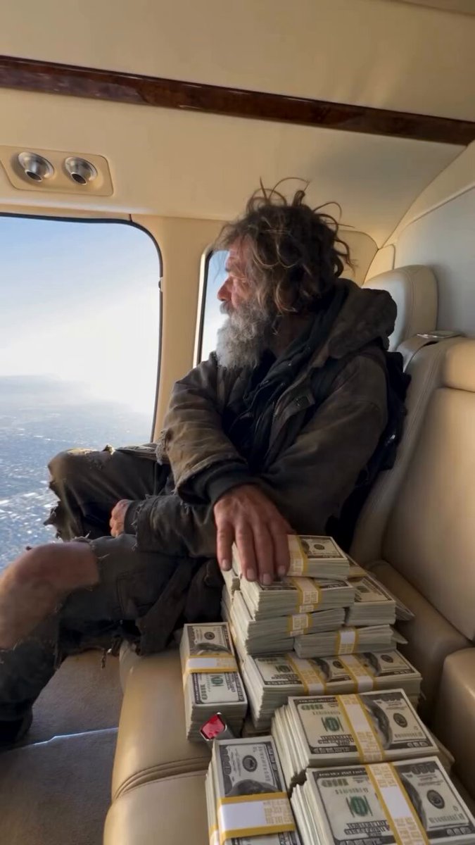 Man dropping cash stacks from a helicopter