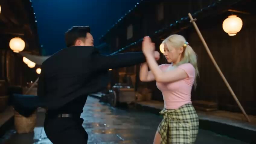 Martial arts fight sequence with platinum-blonde fighter