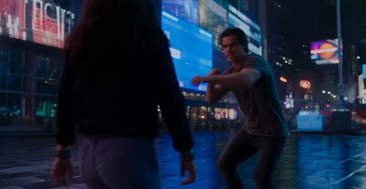 Neon street fight between man and woman