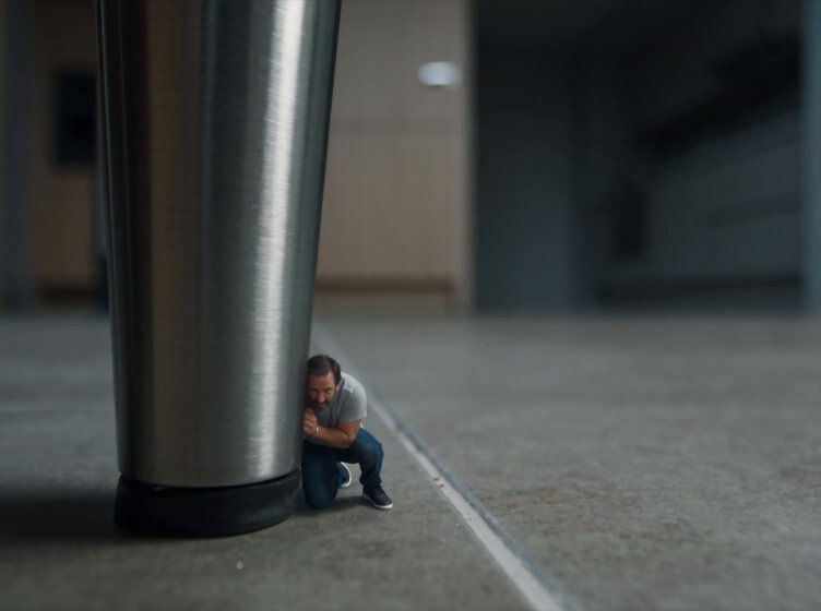 Shrunken man hiding from home invaders
